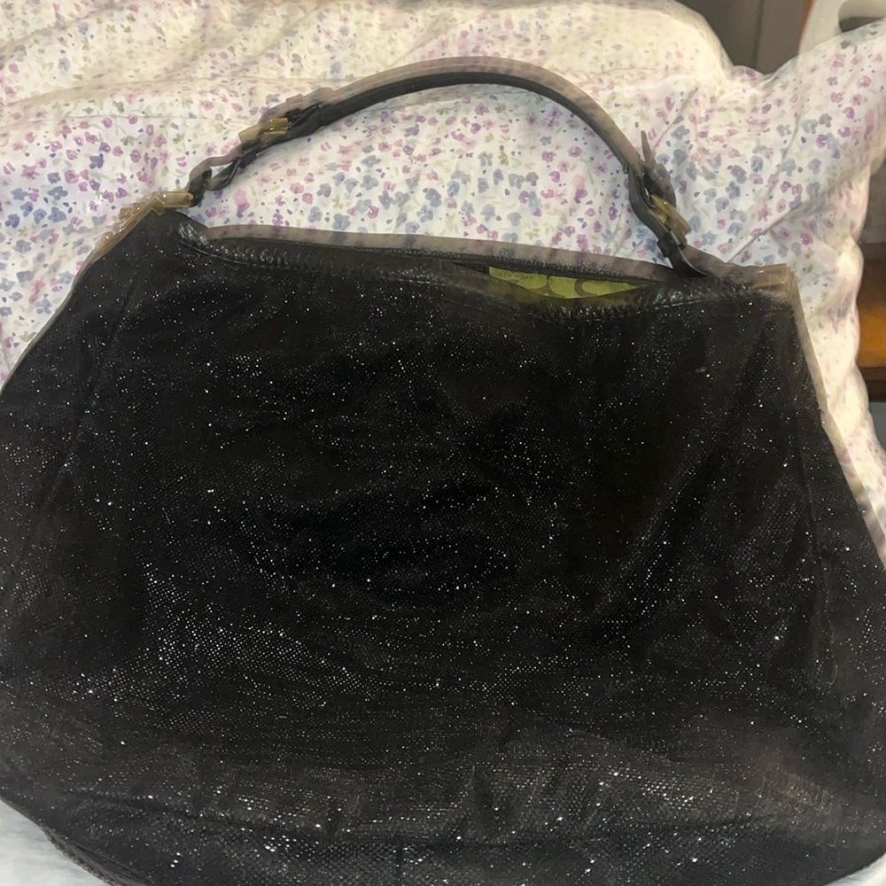 Oryany hobo bag studded, gently used bag. Repairable tear on one inside pocket